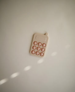 Mushie phone press toy // Blush